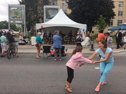 Some people are seen dancing to celebrate the official opening of the redone Main Street in Ottawa.