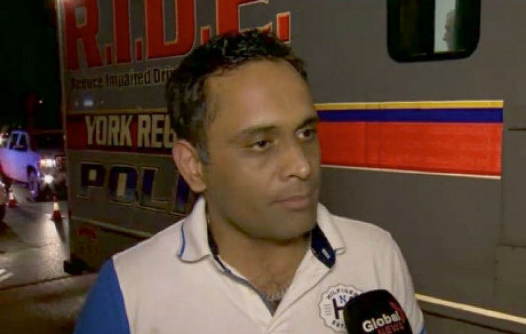 Kunal Gautam speaks to a Global news reporter in this picture.