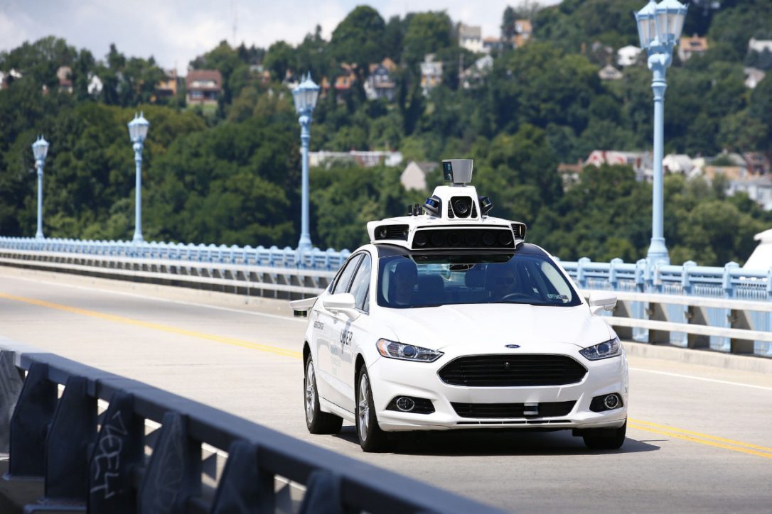 An Uber self-driving car is pictured on a bridge.
