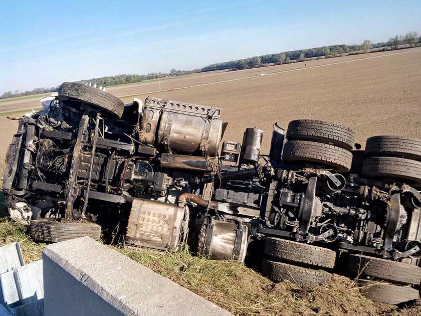 A tractor trailer lies on its side after rolling over on Highway 401 in the Chatham-Kent area on the morning of Oct. 17, 2017.