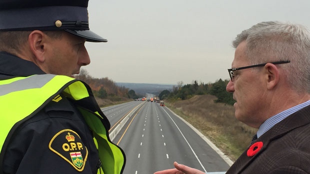 Sgt. Kerry Schmidt with OPP is seen talking to OPP Commissioner Vince Hawkes at the scene of the deadly crash on Highway 400 near Highway 89 on Wednesday. (CP24/Nick Dixon)