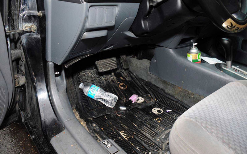 Torstar News Service A police photo, entered as evidence at the trial of Gideon Fekre, shows a water bottle on the floor of the Honda he was driving when he fatally struck Kristy Hodgson, 31 as she walked her dogs on a Dundas St. E. sidewalk near Carlaw Ave. on April 20, 2015.