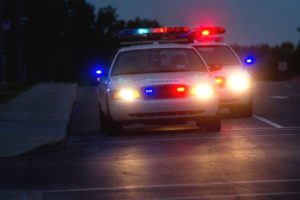 Stock image of police cars in pursuit