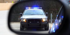 Peel Regional Police vehicle seen in a side mirror