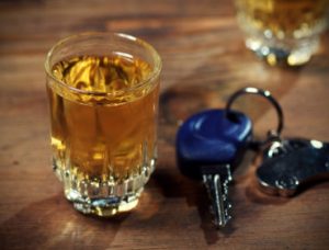 car keys and a whiskey shot