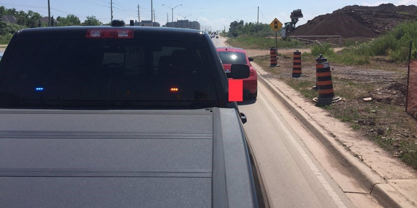 ‘It’s infuriating’: Police say young woman driving in Oakville stops in live lane of traffic to use phone