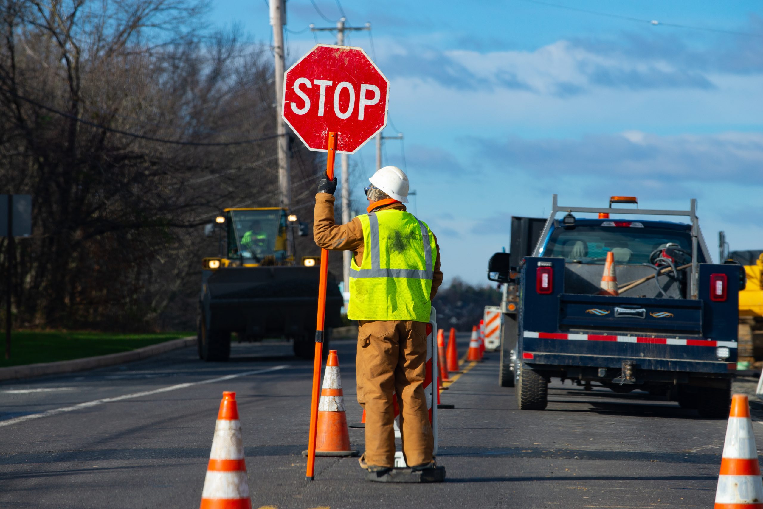 Signs repairs road and worker orange drive